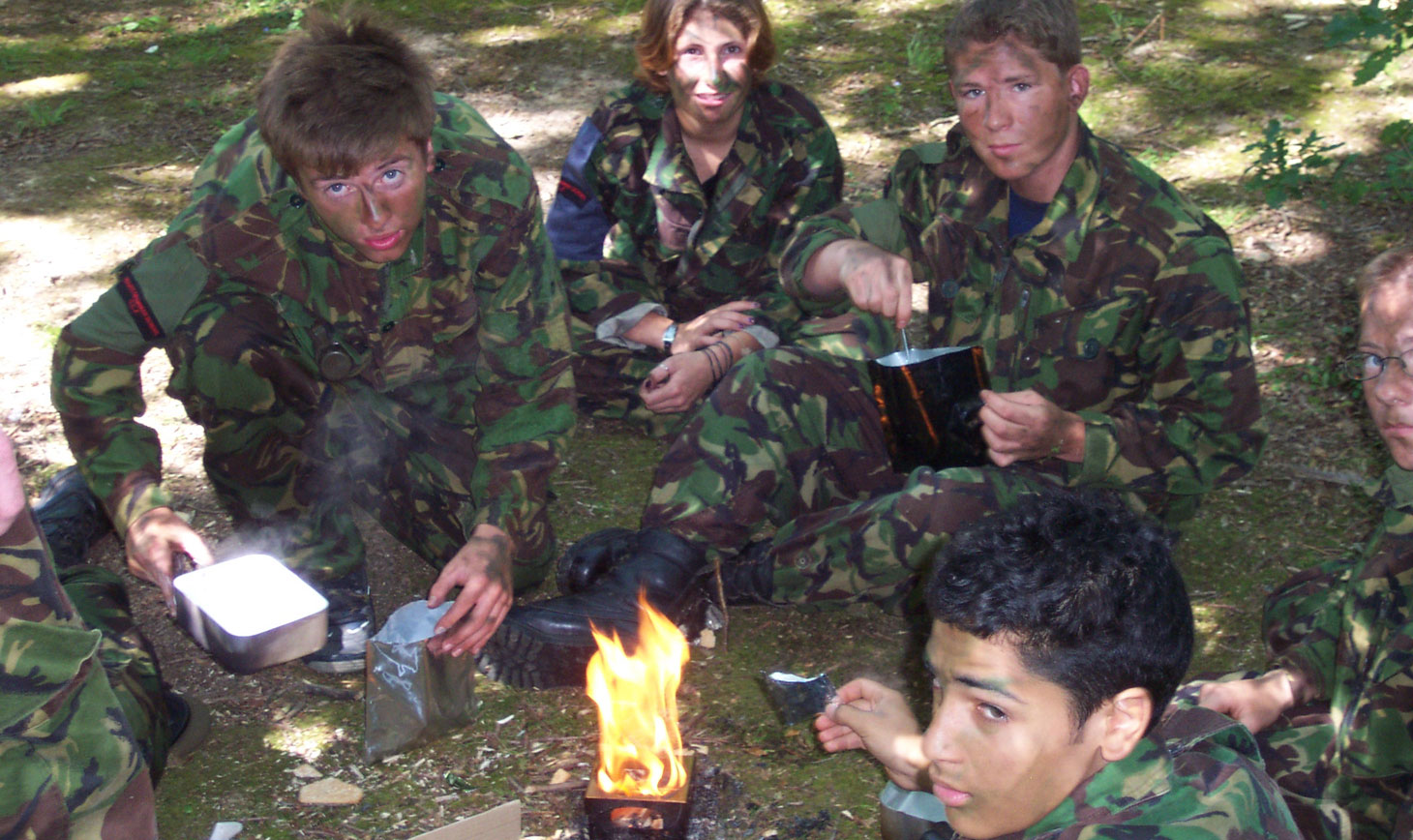 June 2003 and a group CCF students cooking their dinner